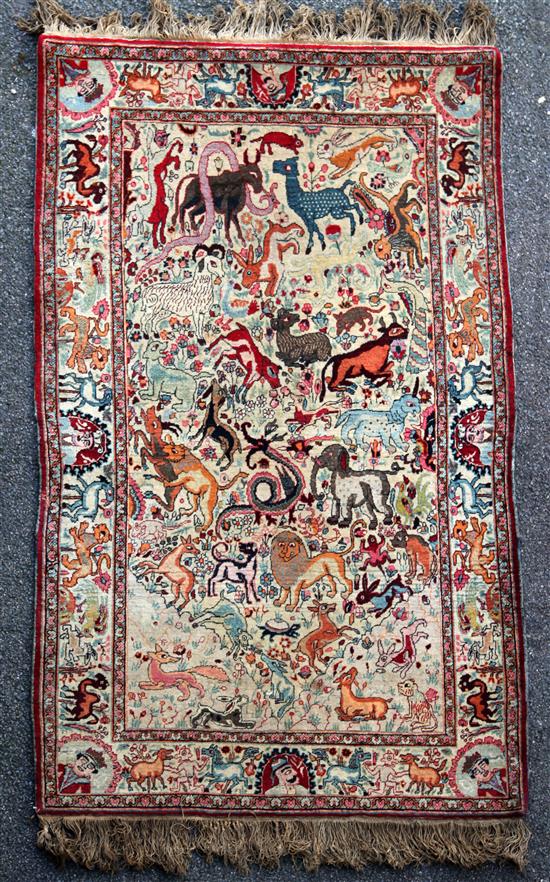 An early 20th century Kirman hunting rug, 6ft 5in by 4ft 2in.